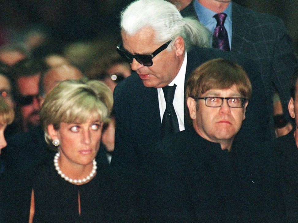 Princess Diana in 1997 with British singer Elton John and fashion designer Karl Lagerfeld, at the memorial mass for the designer Gianni Versace in Milan, Italy