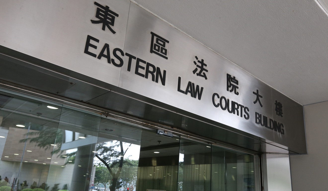 Surveyor Wong Yat-ho, 28, appeared at Eastern Court, accused of allegedly pressing on the back and shoulders of Fu Guohao At Hong Kong International Airport on August 13. Photo: Nora Tam