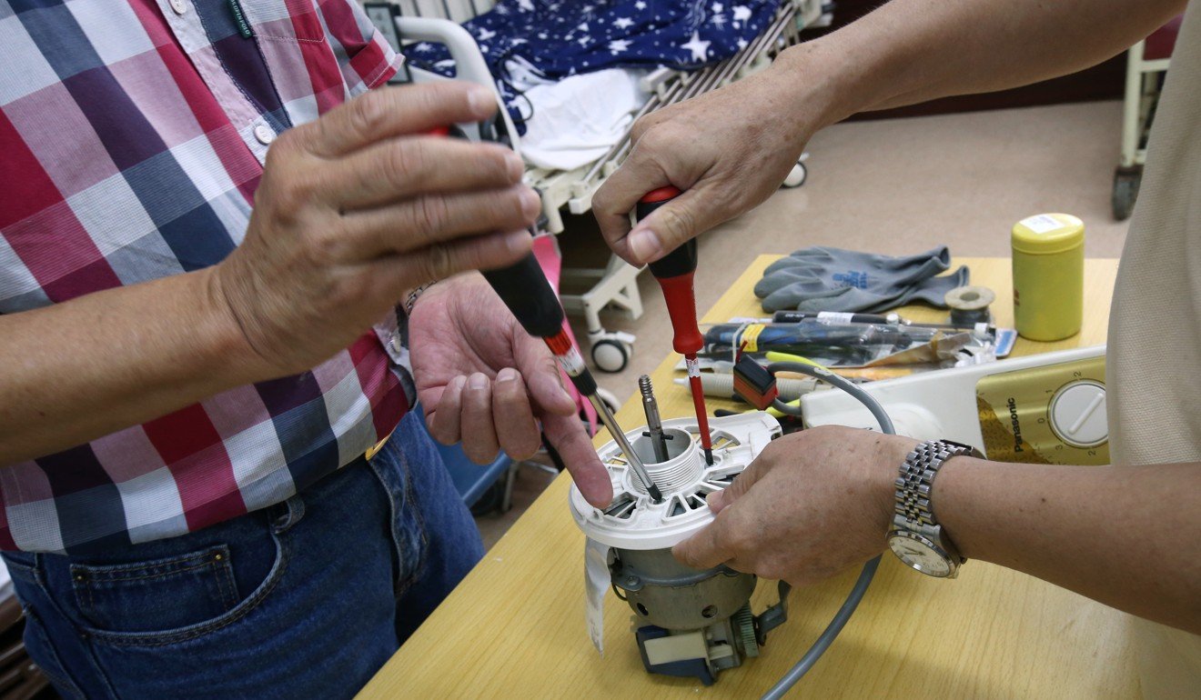 Repair Cafe volunteers repair household items for the elderly and housebound. Photo: David Wong