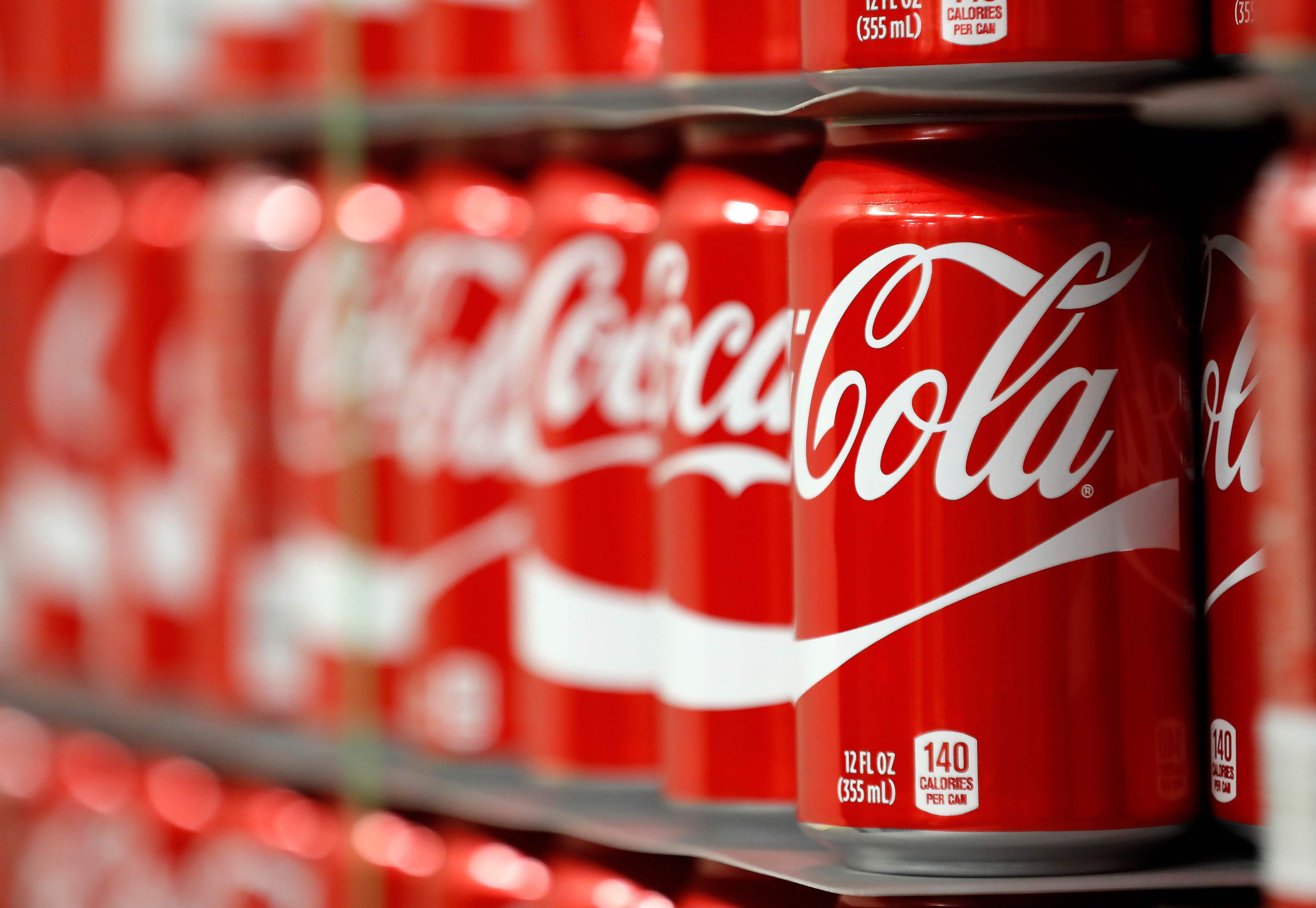 Coca-Cola offers easy calories to a trail runner desperate to replenish dwindling energy, but what is it doing to their oral hygiene? Photo: AFP