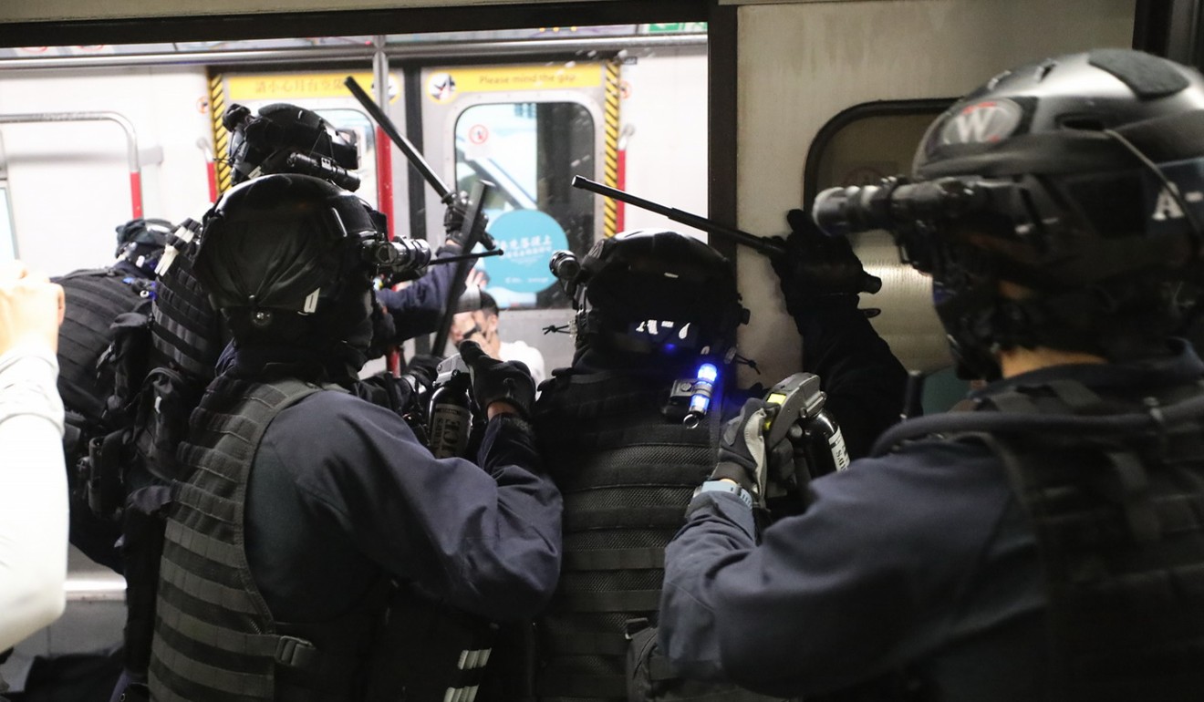 Riot police storm into a train to chase protesters at Prince Edward station on August 31. Photo: Handout