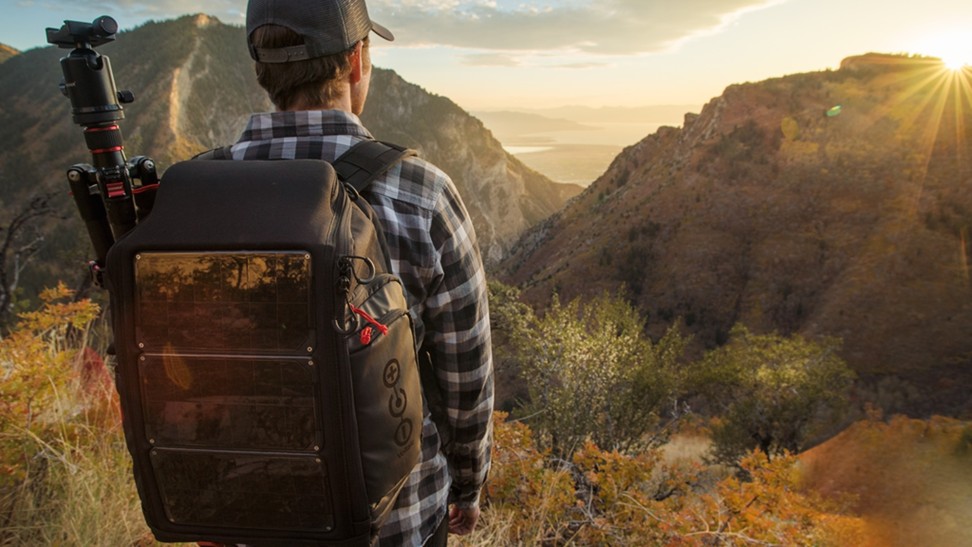 A traveller with the Voltaic Systems array rapid solar backpack charger.