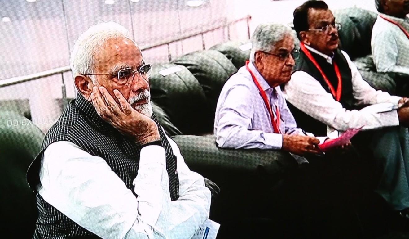 Indian Prime Minister Narendra Modi (left) reacts at the Indian Space Research Organisation ground station after news that communication with the Vikram landing had been lost on Saturday. Photo: EPA-EFE