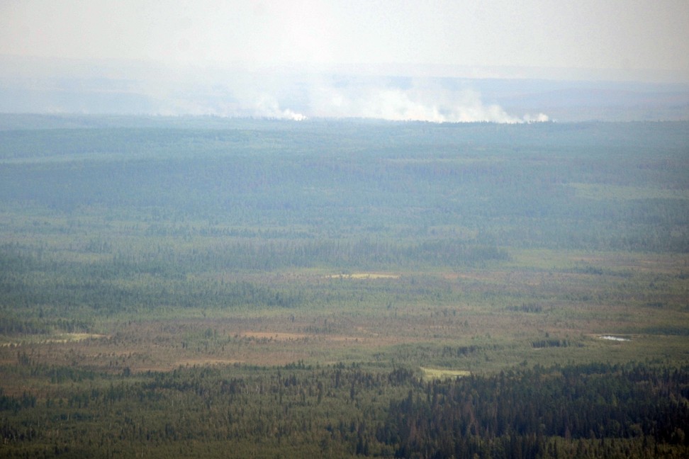 Smoke rises from forest fires in the Boguchansky district of Russiaâ€™s Krasnoyarsk Krai on August 4. Photo: EPA