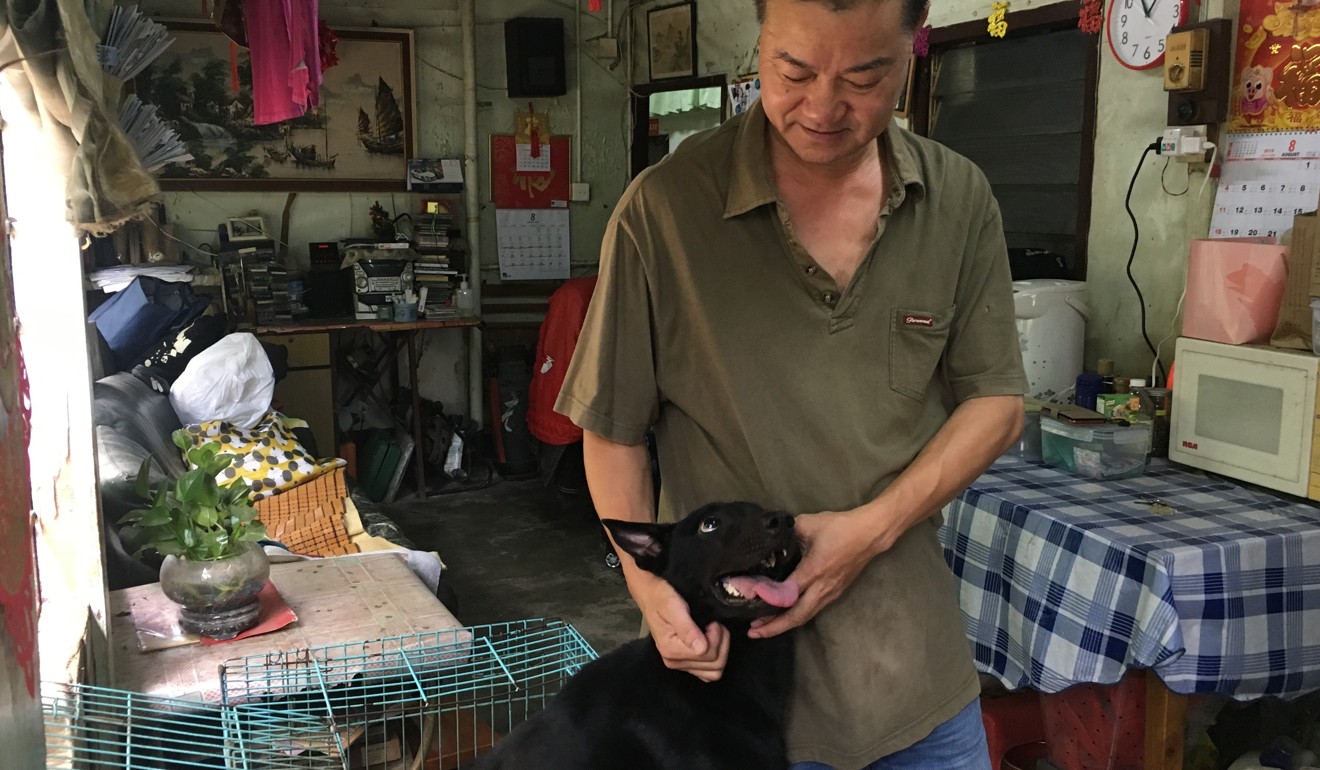Villager Wan Kwong-sing and his dog at home in Ma Shi Po Village. Photo: Fiona Sun