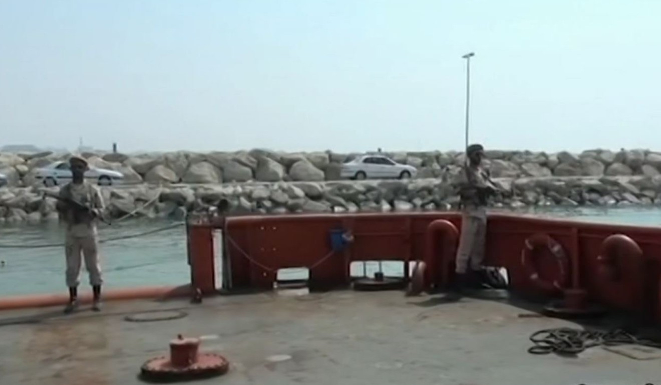 Iranian armed guards on a boat seized in the Strait of Hormuz. Photo: IRINN via AFP