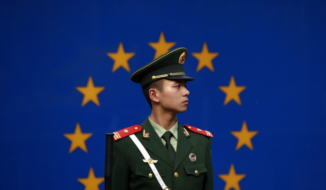 A Chinese paramilitary policeman on duty in front of the European Union flag in Beijing, China. Photo: AP