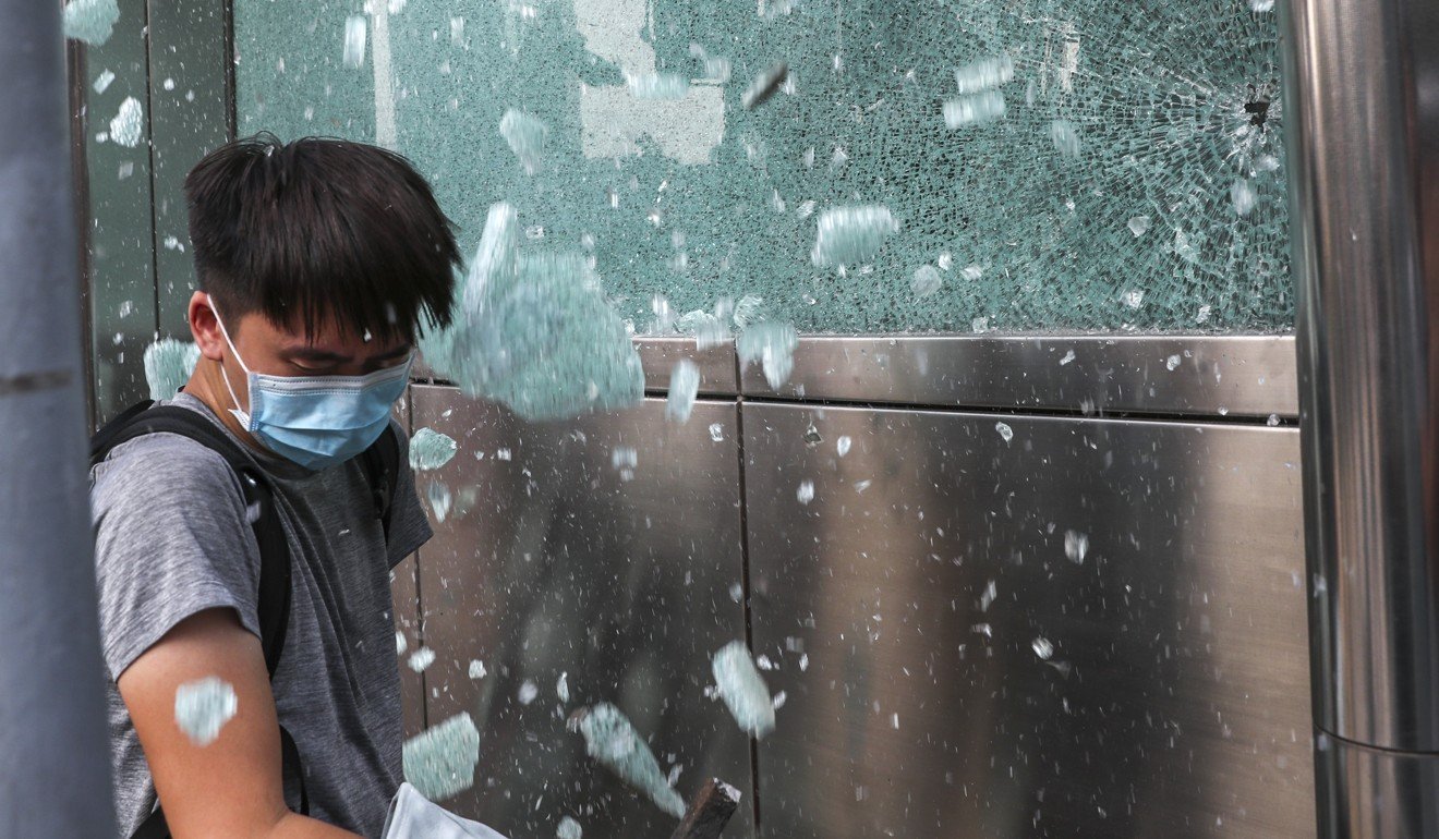 Protesters smashed the windows at another entrance of Central MTR Station. Photo: Sam Tsang