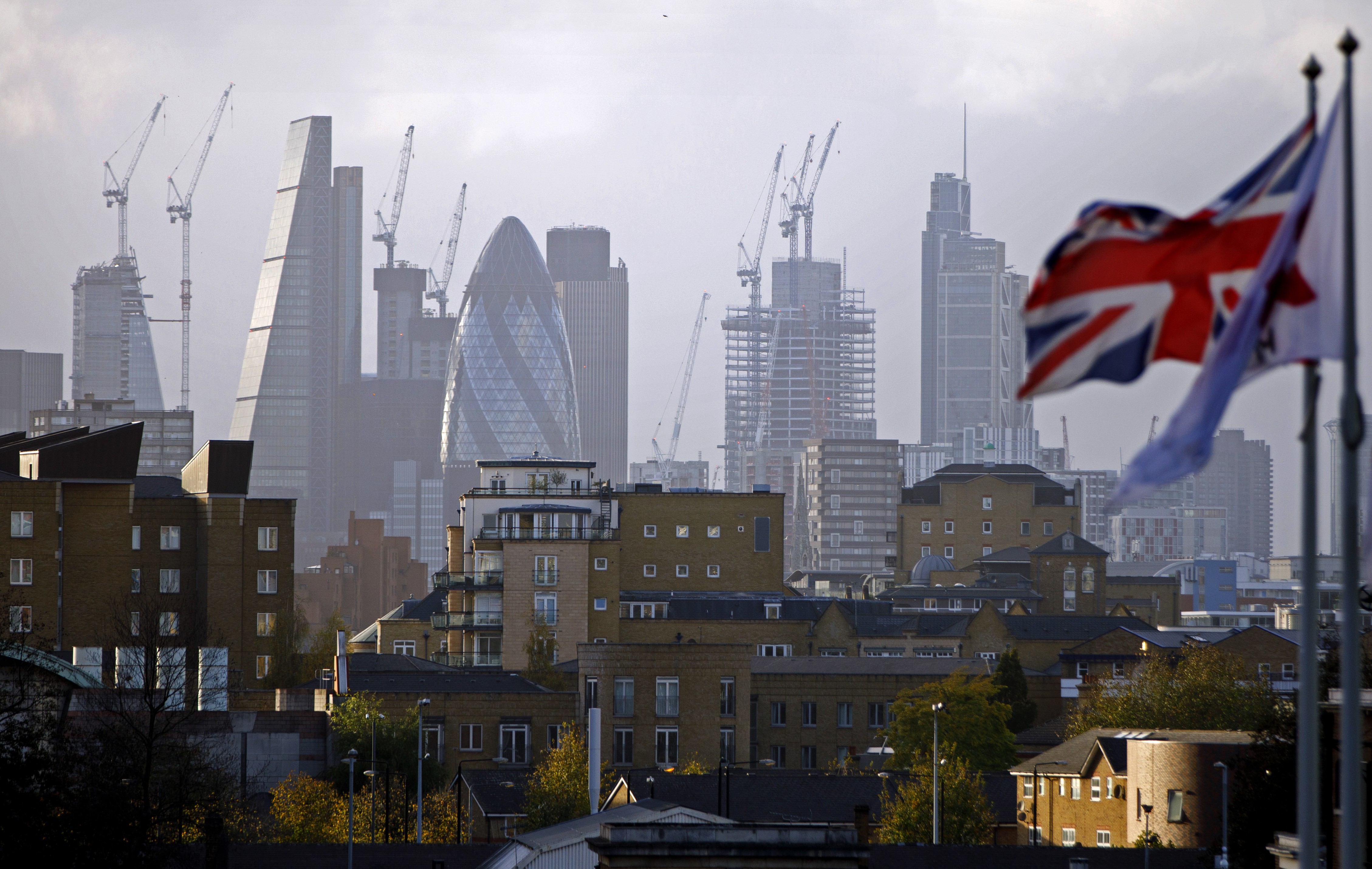 Construction cranes stand near skyscrapers in the City of London. Applications for so-called tier-1 investor visas to the UK by ultra-wealthy Chinese jumped by more than half in the first quarter of 2019. Photo: AFP