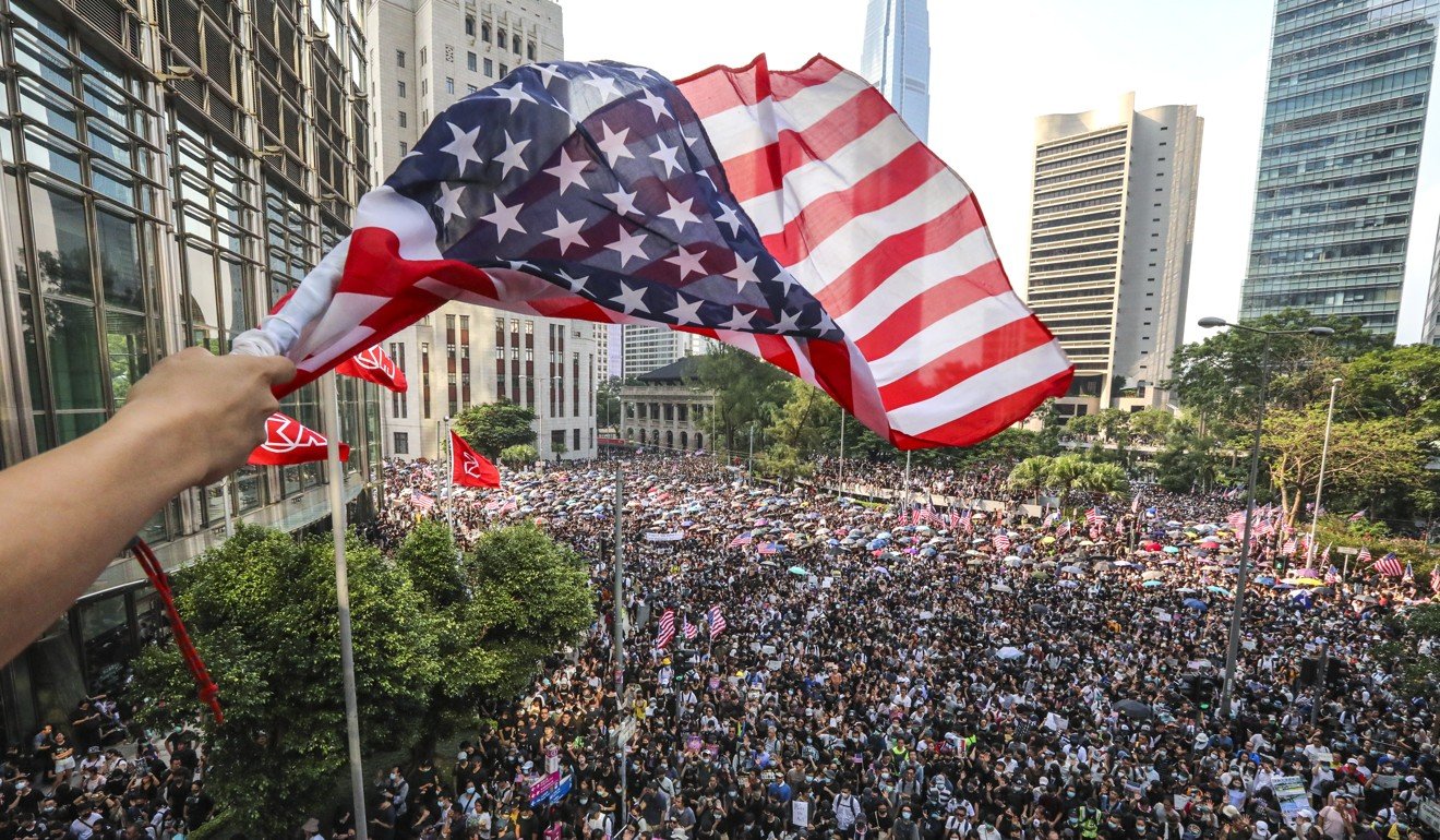 The Stars and Stripes was out in force in Hong Kong on Sunday, as residents marched to the US Consulate. Photo: Felix Wong