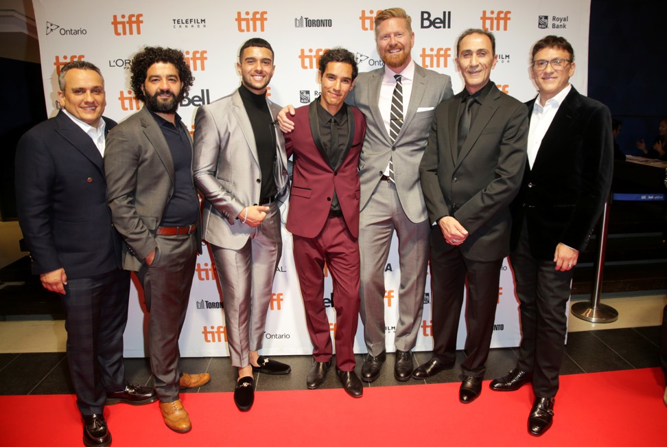 Joe Russo (left) and Anthony Russo (right) with Mosul director Matthew Michael Carnahan (third right) and cast members at the film’s premiere. Photo: Reuters