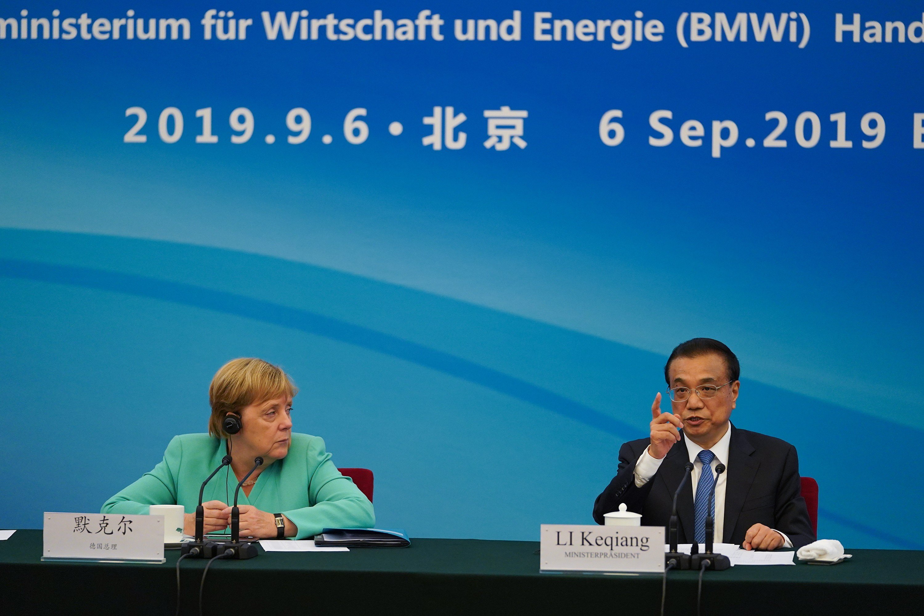 German Chancellor Angela Merkel and Chinese Premier Li Keqiang talk during a session about economic relations in Beijing, on September 6. Merkel’s comments on Hong Kong and Li’s response added to EU-China tension as both sides work on an investment agreement ahead of a possible recession. Photo: EPA-EFE