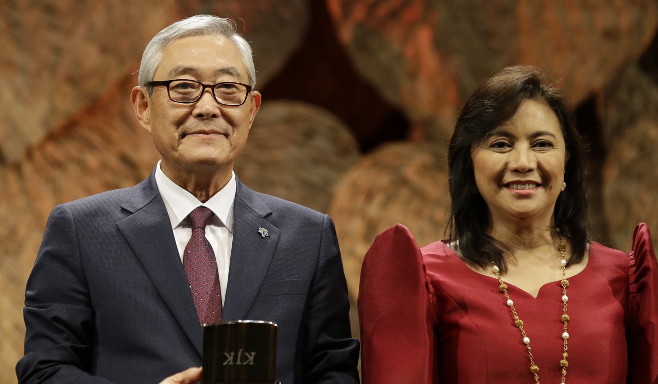 Awardee Kim Jong-ki, left, with Philippine Vice-President Leonor Robredo at the ceremony. Photo: AP
