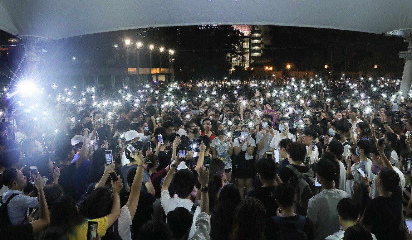 A crowd of mostly young people showed up in Wong Tai Sin to chant slogans and sing. Photo: Sam Tsang