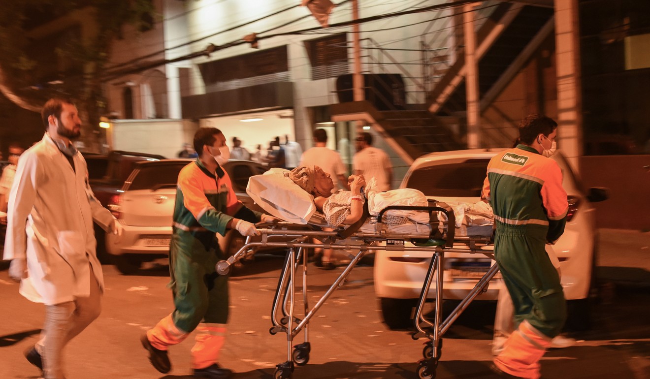 Paramedics transport an injured person. Photo: DPA