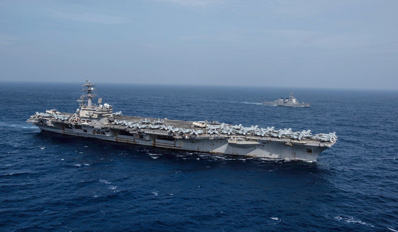 The USS Ronald Reagan aircraft carrier sails alongside a Japan Maritime Self-Defence Force guided-missile destroyer during drills. Photo: Handout