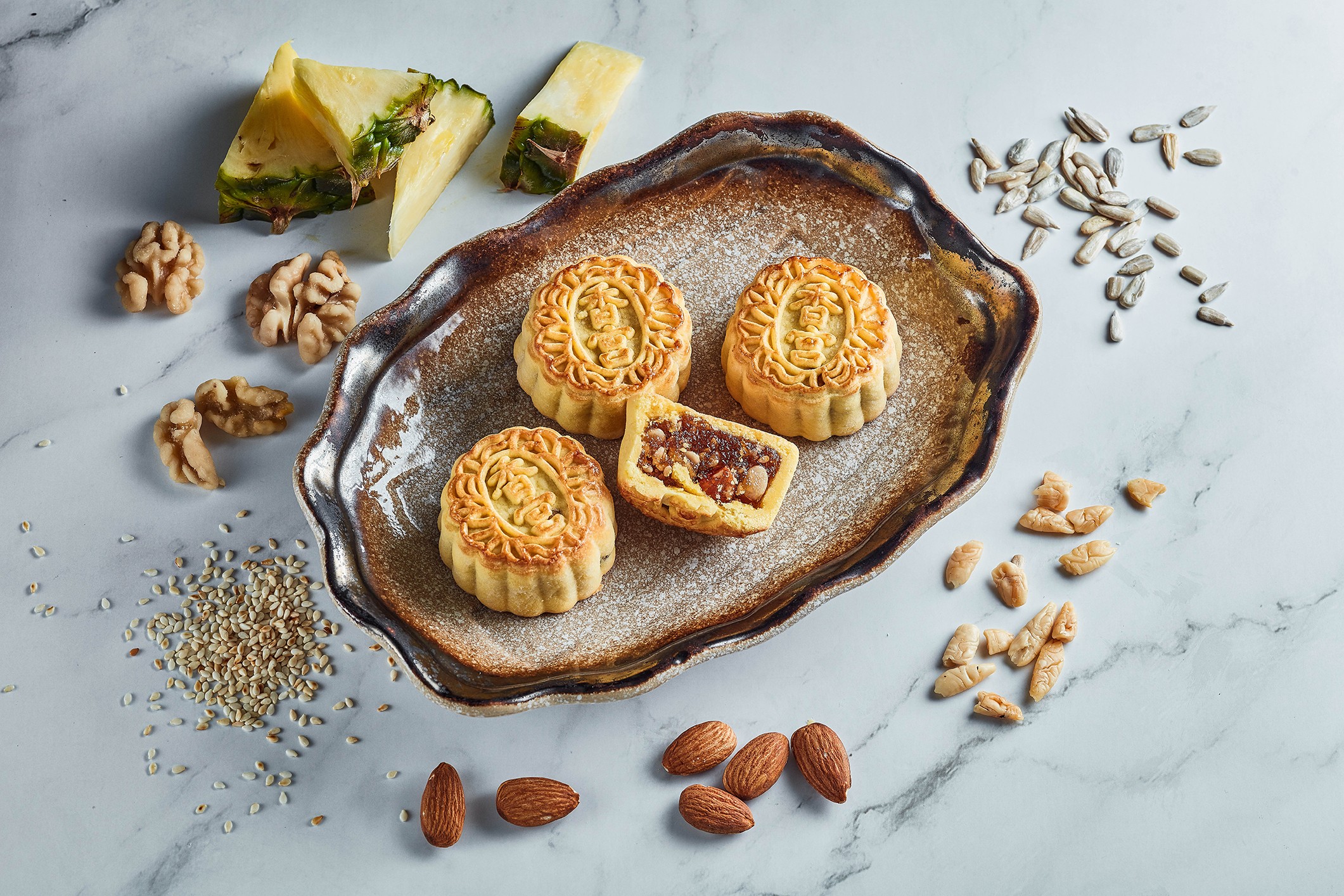 Kowloon Shangri-La offers Mini pineapple paste and five-seed mooncakes during the Mid-Autumn Festival.