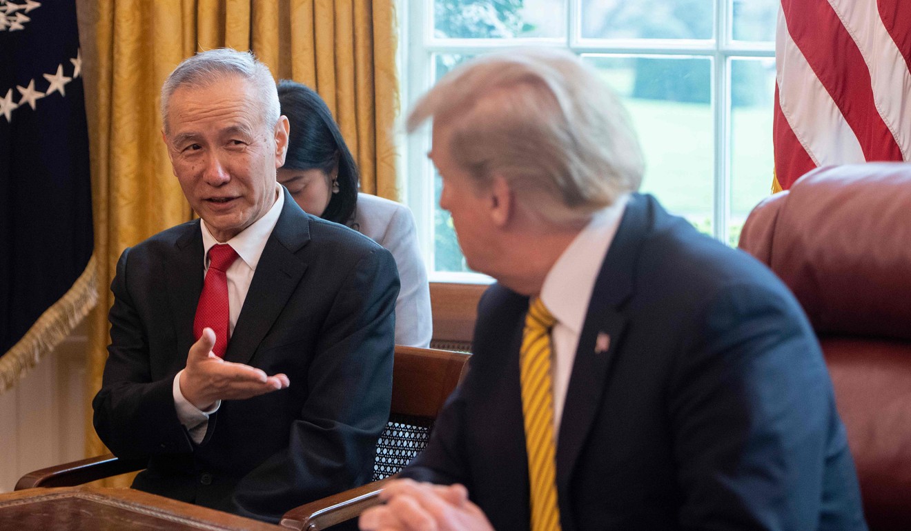 China's Vice-Premier Liu He, shown with Trump on April 4, has indicated a willingness to achieve some sort of interim trade deal. Photo: AFP