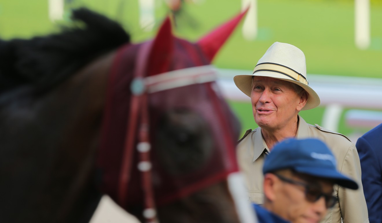 John Moore admires Buddies after his win at Sha Tin on Sunday.