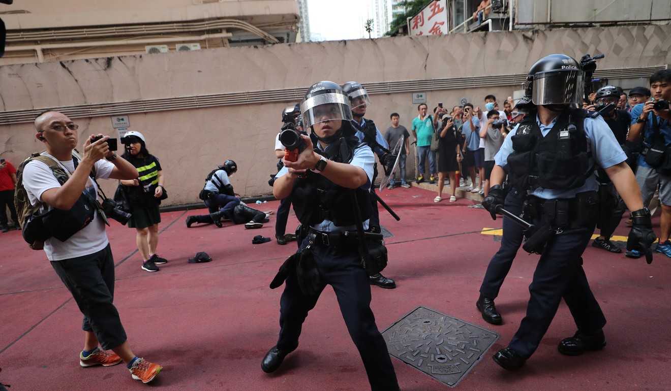Riot police are on the scene as the fighting continues in Amoy Plaza. Photo: Sam Tsang