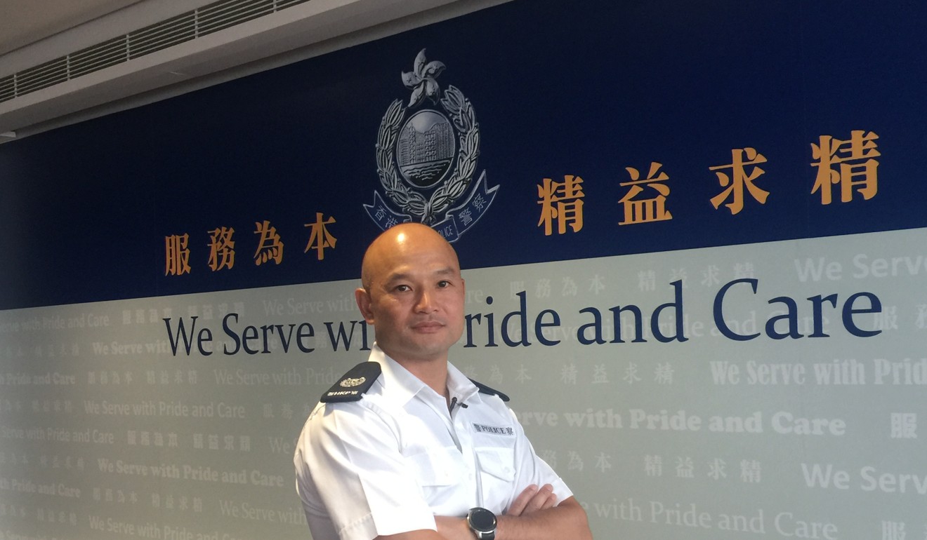 Sergeant Lau Chak-kei at police headquarters in Wan Chai. Photo: Xinhua