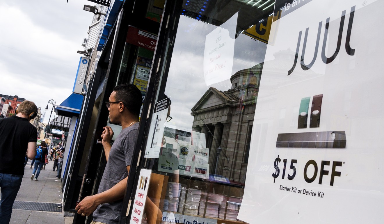 A sign advertises Juul pods, used for vaping in e-cigarettes, outside of a store in New York. Photo: EPA-EFE