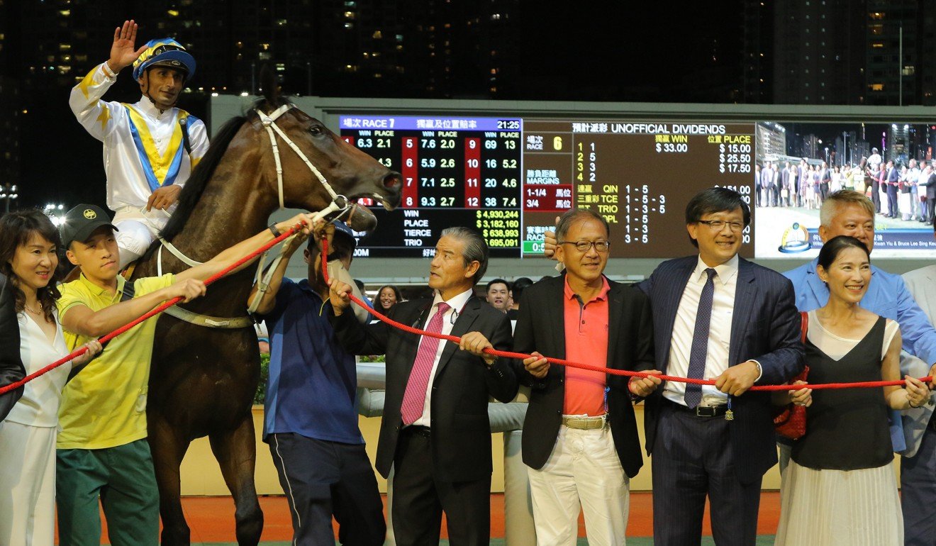 Hong Kong Bet’s connections celebrate a win at Happy Valley in July. Part-owner Junius Ho is second from right.