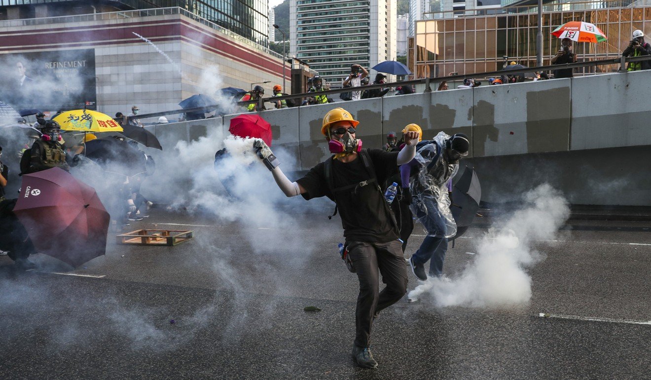 Battles and brawls in Hong Kong’s commercial heart as peaceful protest ...