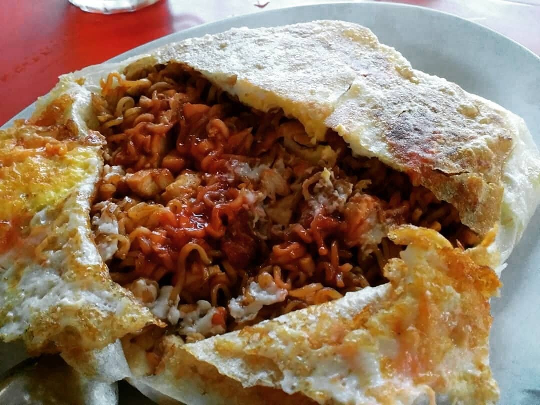 Roti Maggi is sheer delight for its playful spin on two Malaysian favourites: roti canai and Maggi goreng (stir-fried instant noodles). Photo: Instagram/janism.ch