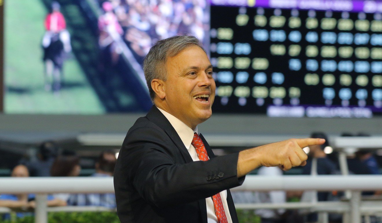 Trainer Caspar Fownes celebrates a Happy Valley winner.