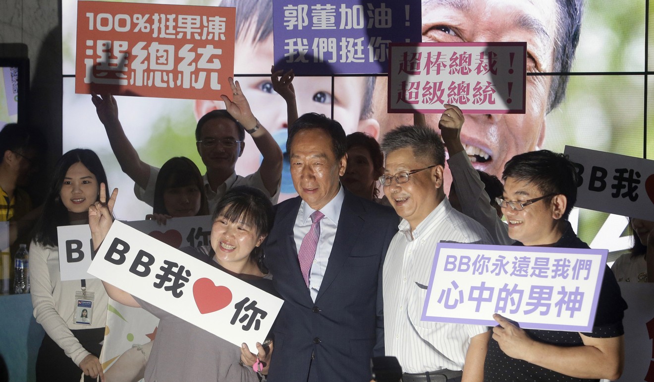 Terry Gou (centre) poses with supporters in June in New Taipei City. Photo: AP