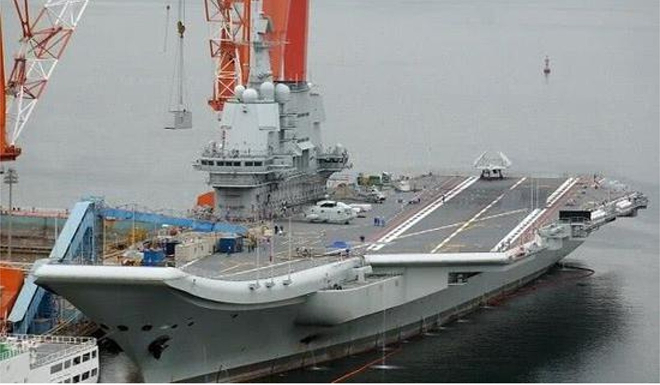The aircraft carrier’s hull has been painted black below the waterline. Photo: Handout