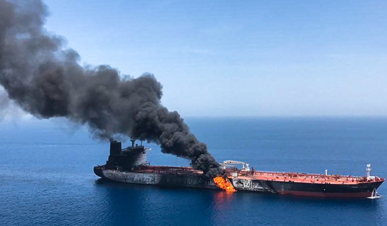 Fire and smoke billows from a tanker said to have been attacked in waters off Iran in June. Photo: AFP