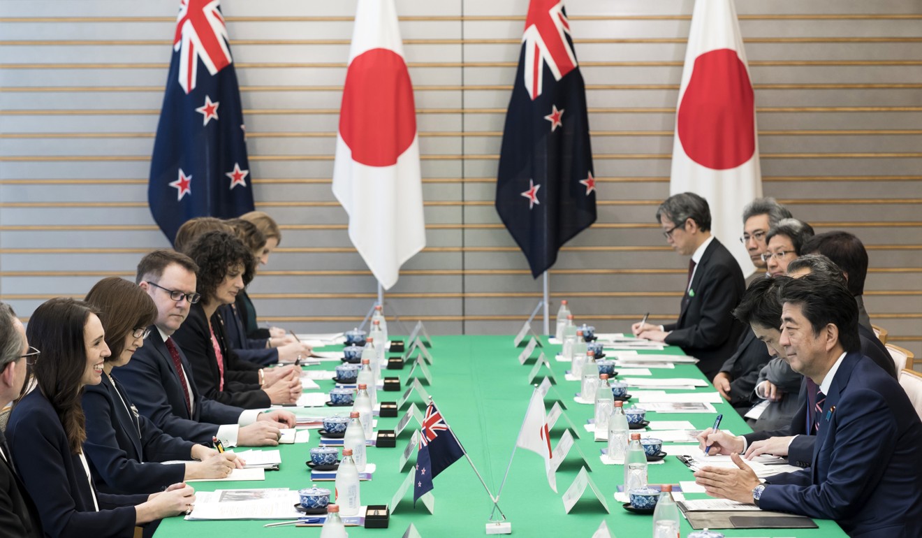 New Zealand’s PM Jacinda Ardern speaks to Japanese Prime Minister Shinzo Abe during a meeting in Tokyo. Photo: AP