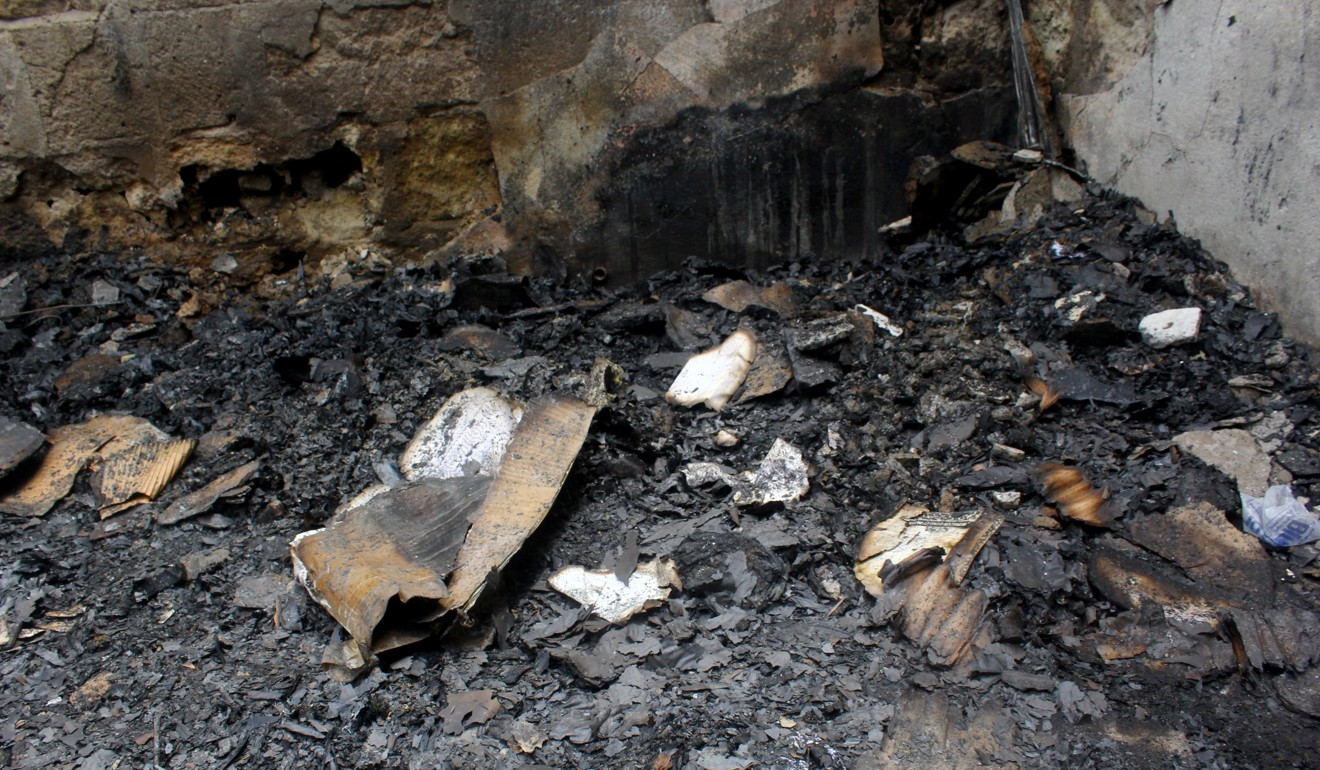 Burned burned books in the ashes. Photo: Reuters