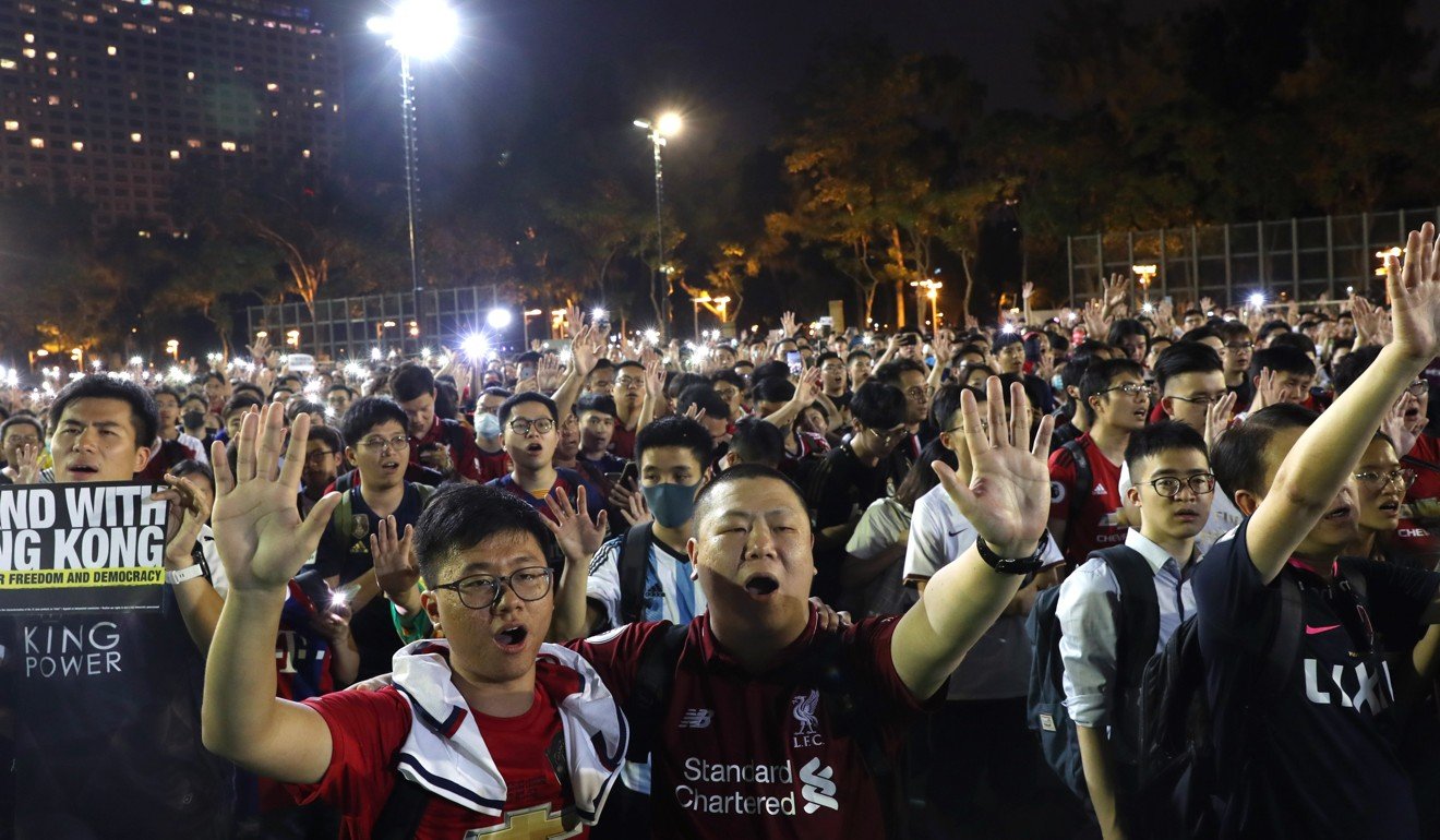 Football fans set aside club allegiances to kick off human chain at ...