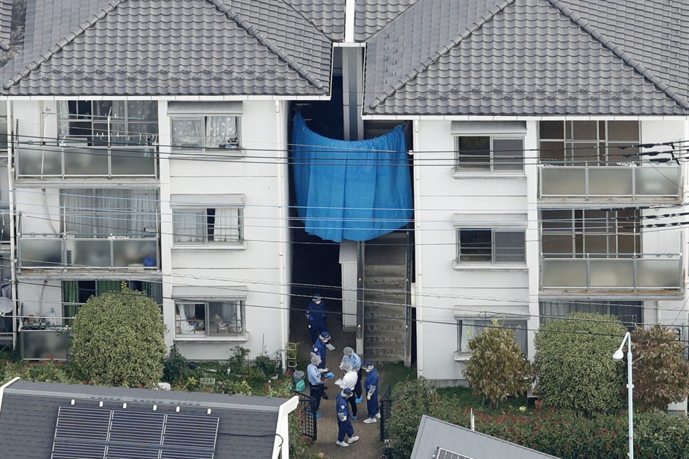 Police at the apartment building in Saitama. Photo: Kyodo