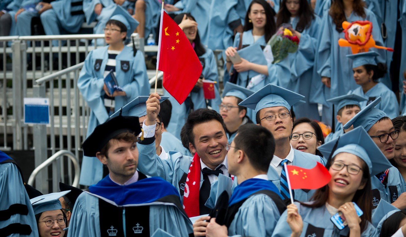 Graduates wave Chinese national flags during the commencement ceremony on May 16, 2018, at Columbia University in New York. Photo: Xinhua