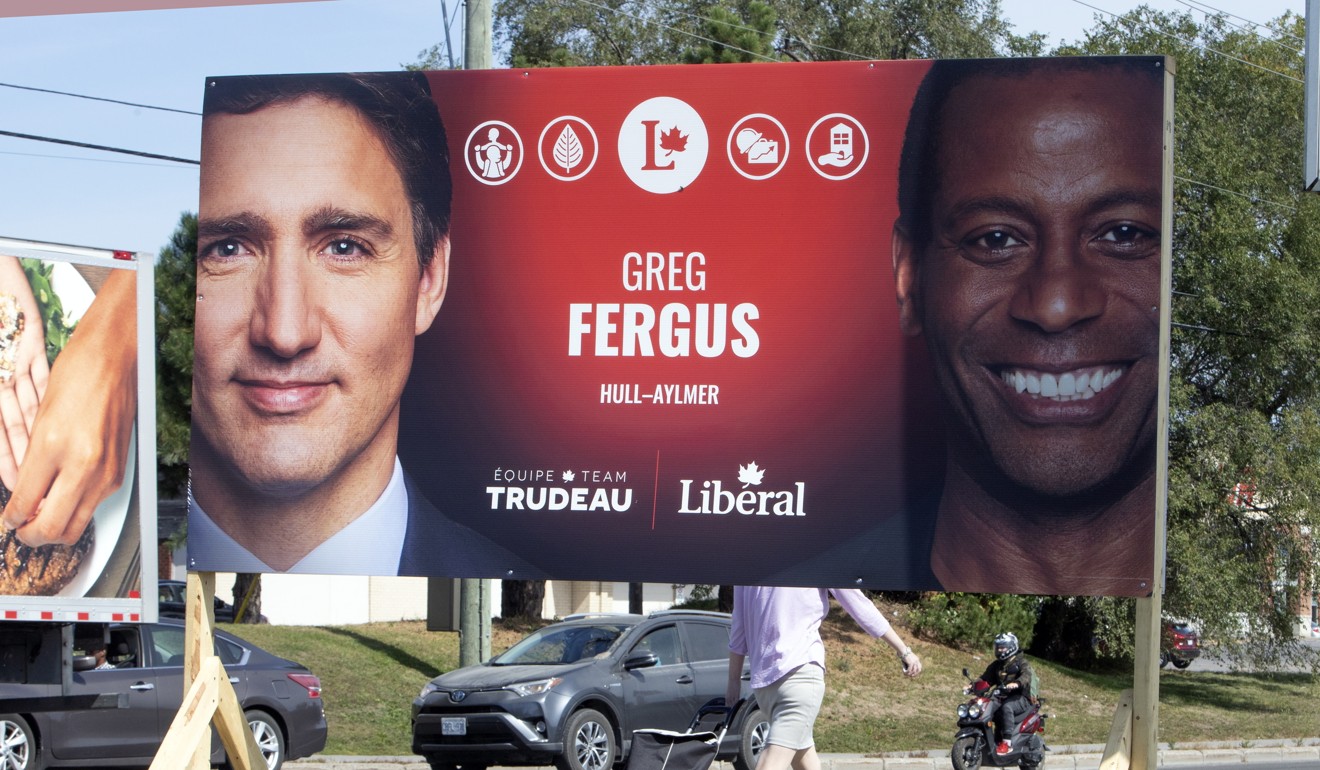 An election sign showing Trudeau with Liberal party candidate Greg Fergus, who said he accepts his party leader’s apology. Photo: AP