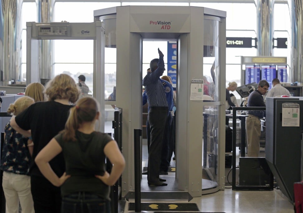A passenger raises his arms for the millimetre wave body scan at Logan Airport in Boston, US, in 2012. Photo: AP
