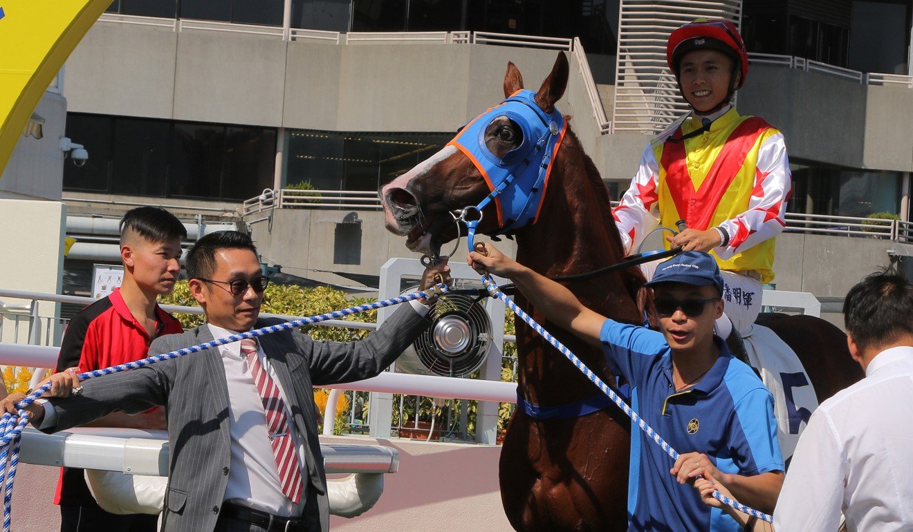 Matthew Poon celebrates the win on the all-weather surface.