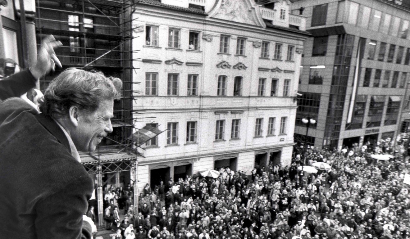 Vaclav Havel, who went on to become Czech president after leading the ‘Velvet Revolution’ against the Communists, waves to supporters from a Prague balcony in 1989. Photo: Reuters