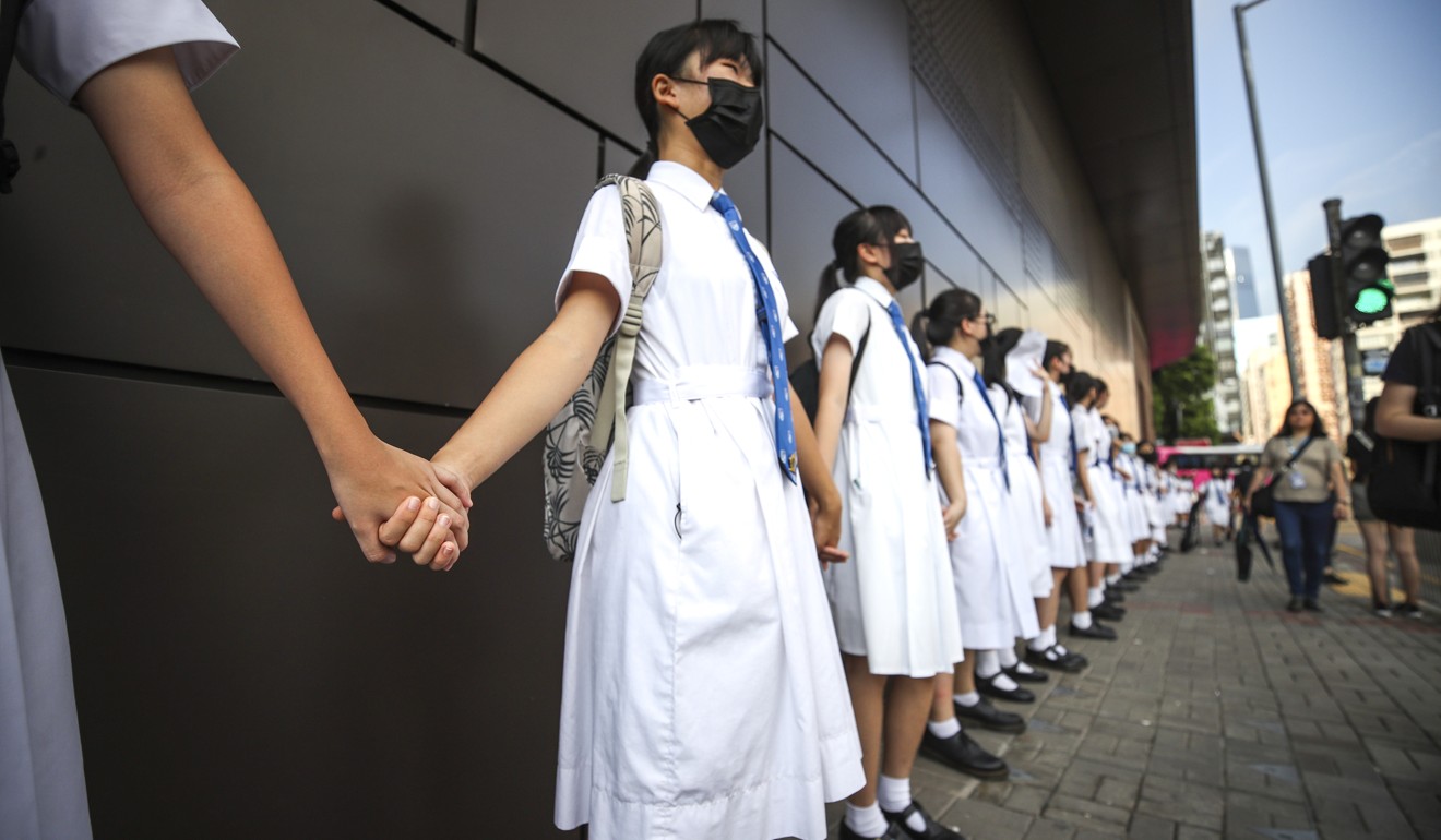 Students from Diocesan Girls' School in Hong Kong formed a human chain this month to press the government into meeting the remaining demands of the 2019 movement, sparked by the now-withdrawn extradition bill. Photo: Winson Wong
