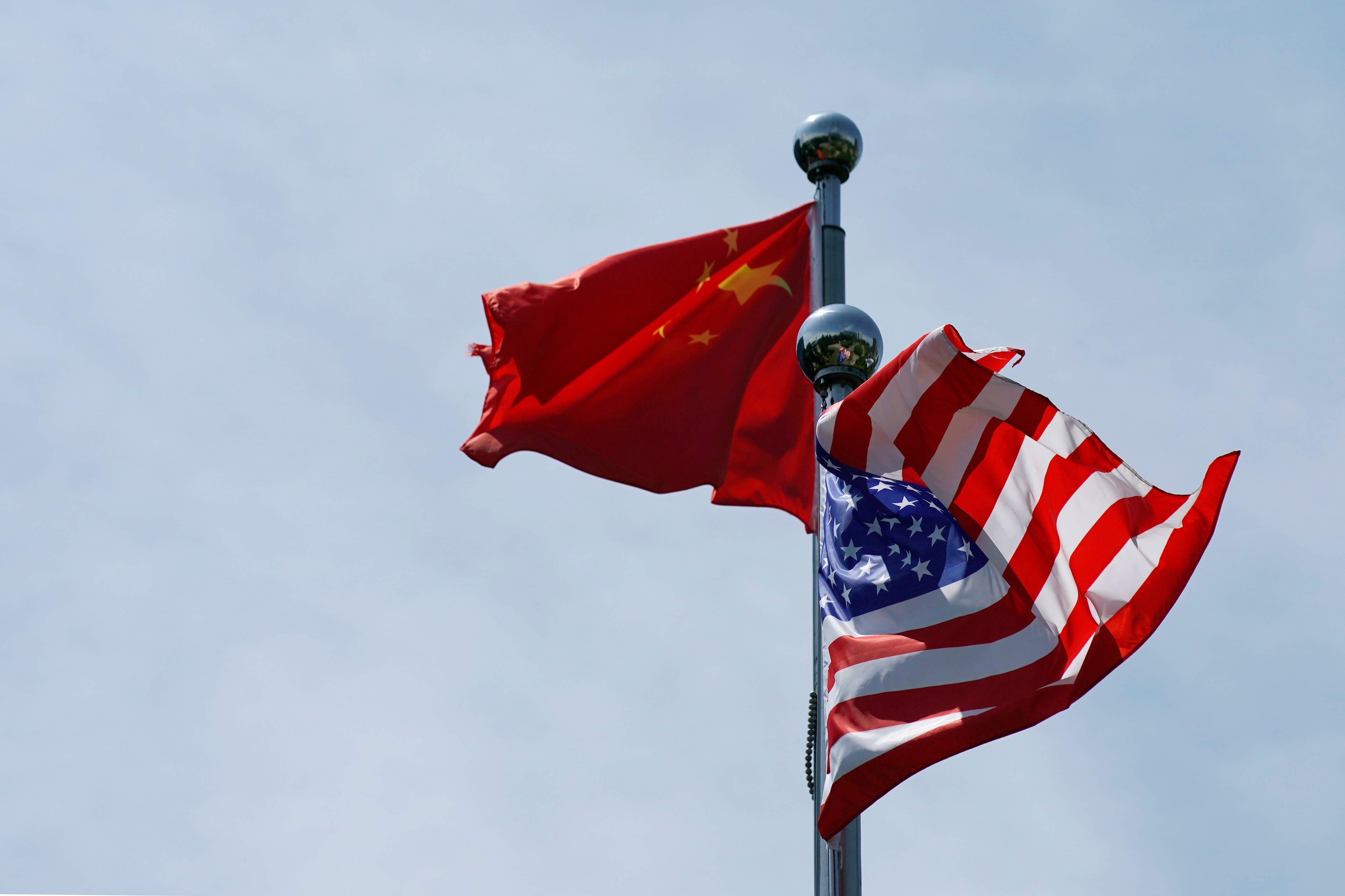The Chinese and US flags flutter near the Bund on July 30, ahead of a meeting between US trade delegates and their Chinese counterparts in Shanghai. Photo: Reuters