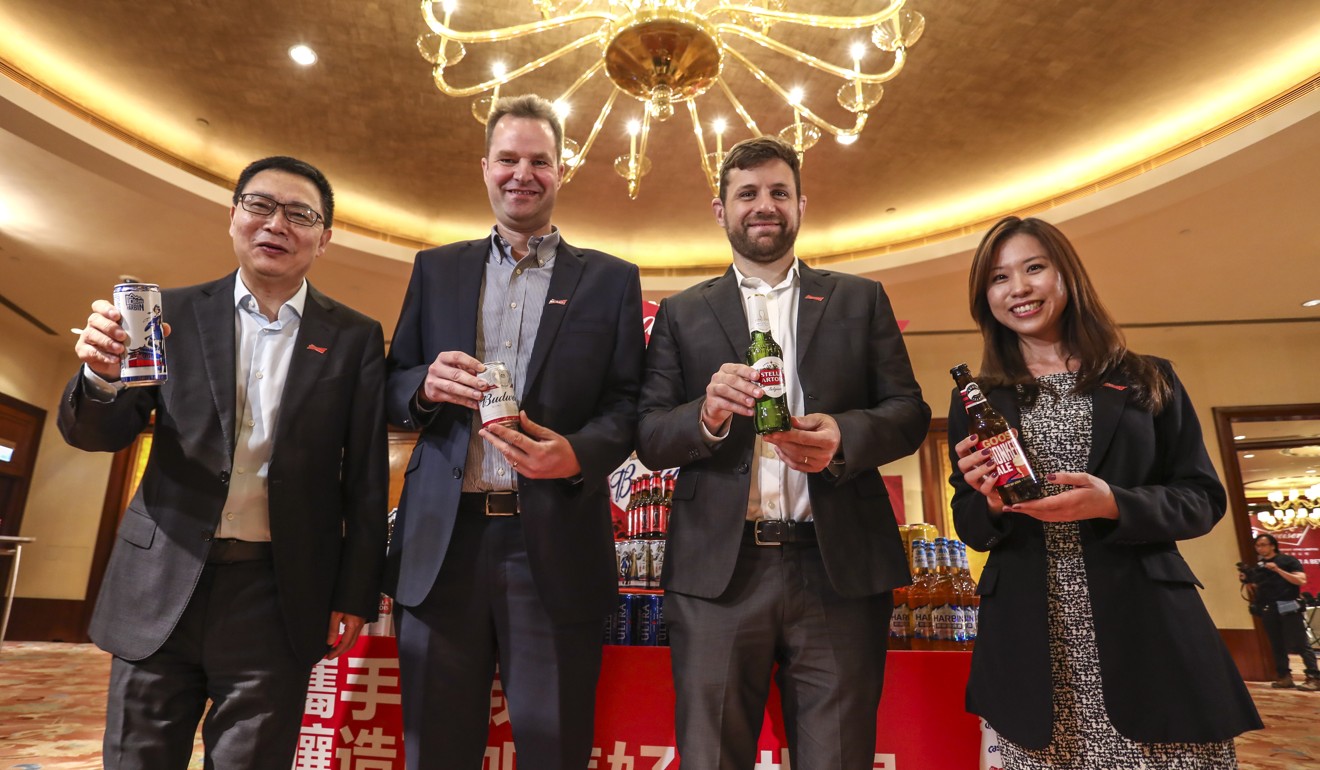 From left, Frank Wang, the executive director, general counsel and joint company secretary at Budweiser Brewing Company APAC, Jan Craps, the company’s executive director and chief executive, Guilherme Castellan, the company’s chief financial officer, and Heidi Li, the company’s head of investor relations, in Hong Kong on Tuesday. Photo: Jonathan Wong