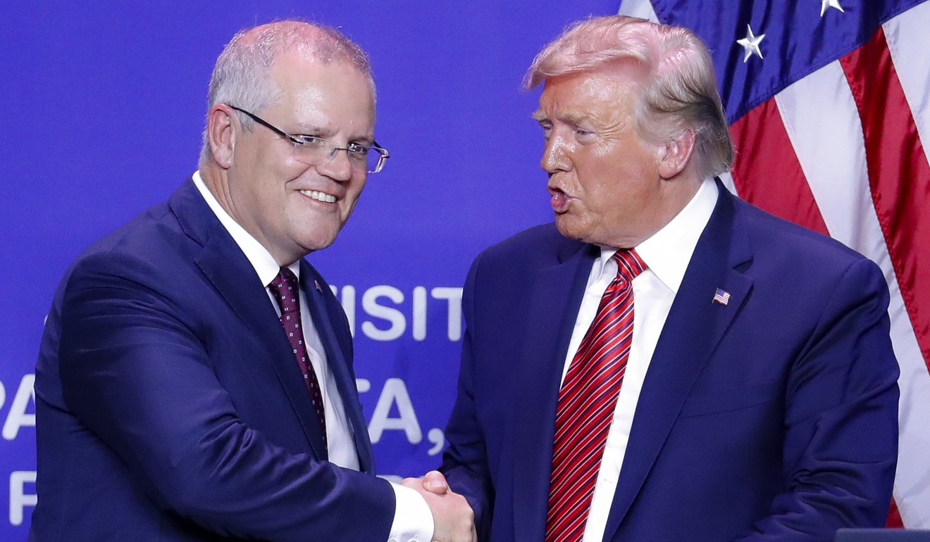 US President Donald Trump (right) and Australian Prime Minister Scott Morrison shake hands after speaking during a joint visit to mark the opening of an Australian-owned Pratt Industries plant in Ohio on Sunday. Photo: AP
