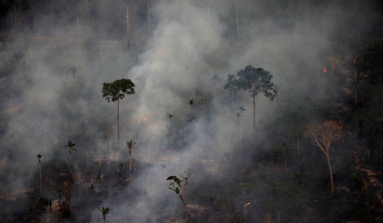 Smoke billows during a fire in an area of the Amazon rainforest near Porto Velho on September 17. Photo: Reuters