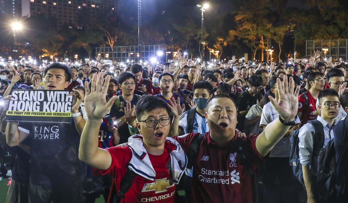 Soccer fans sing Glory to Hong Kong at Victoria Park, Causeway Bay, where they formed a human chain around the perimeter of the park’s six soccer pitches. Photo: Sam Tsang