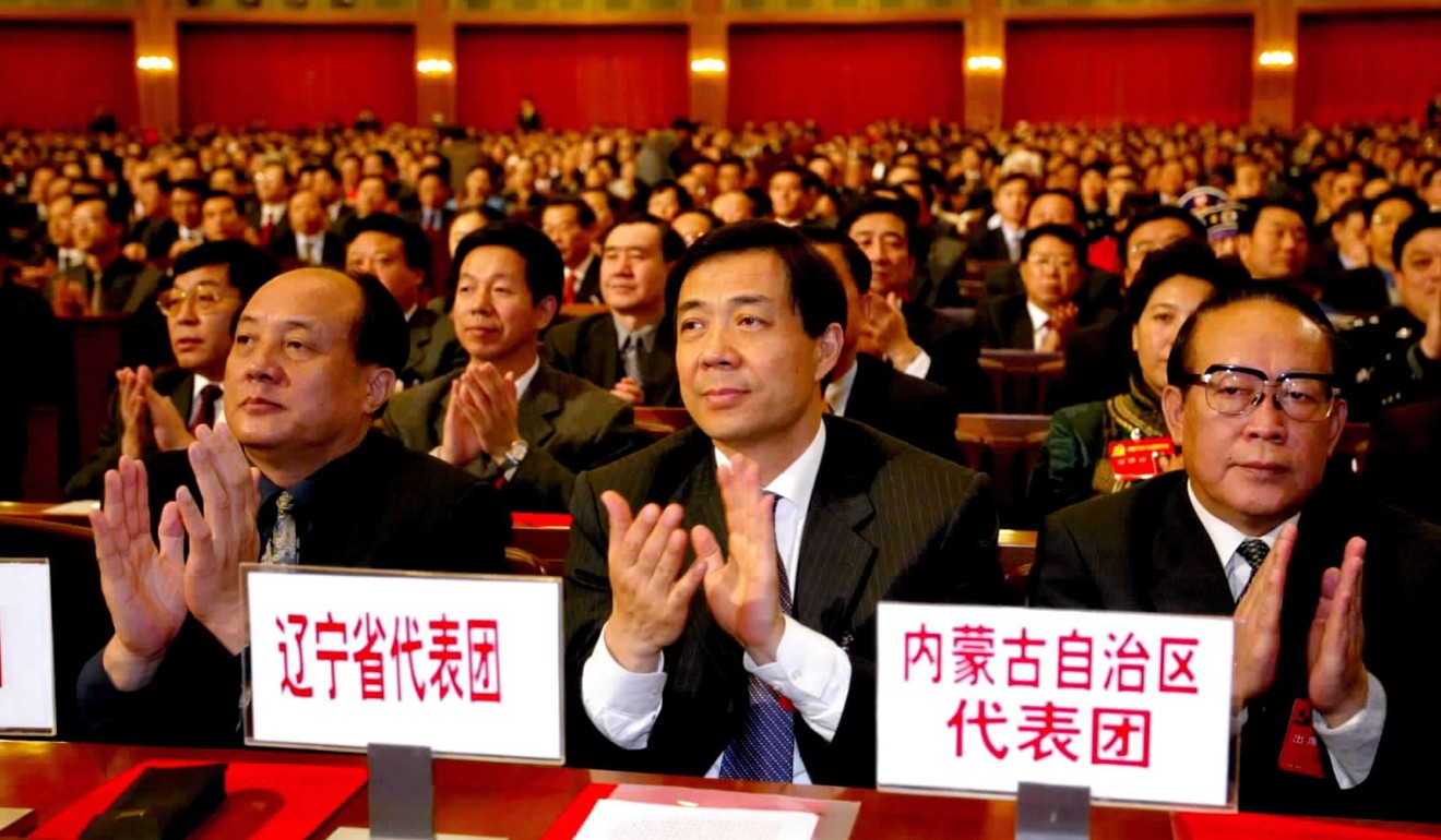 Bo Xilai (centre), when he was governor of Liaoning province, at Communist Party congress in 2002. He later became a darling of neo-Maoists as party secretary in Chongqing, southwest China, before being tried for corruption and jailed.