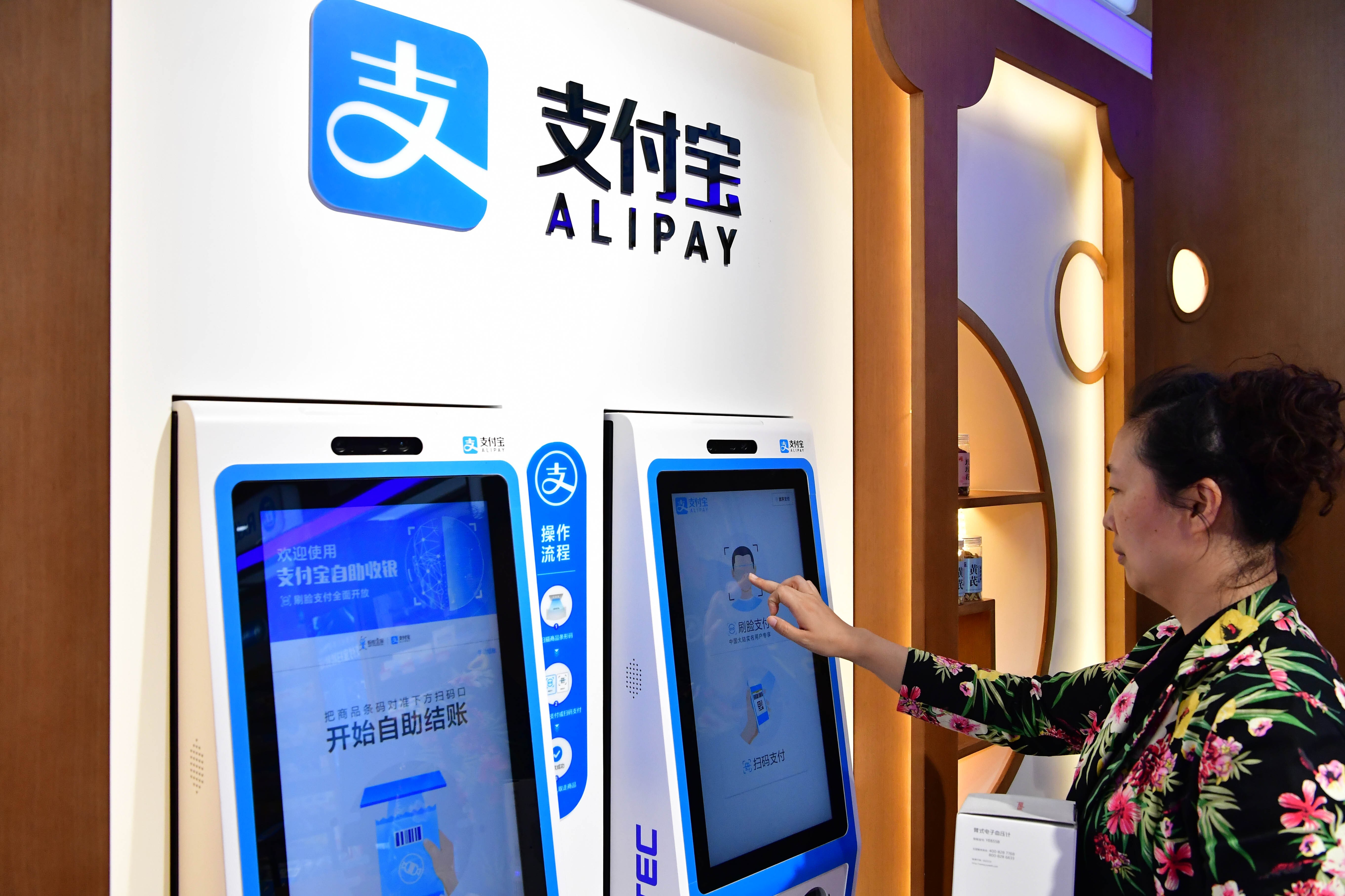 China plans to make its digital currency available through four state-owned banks, as well as online payment platforms like Alipay. Photo: Xinhua
